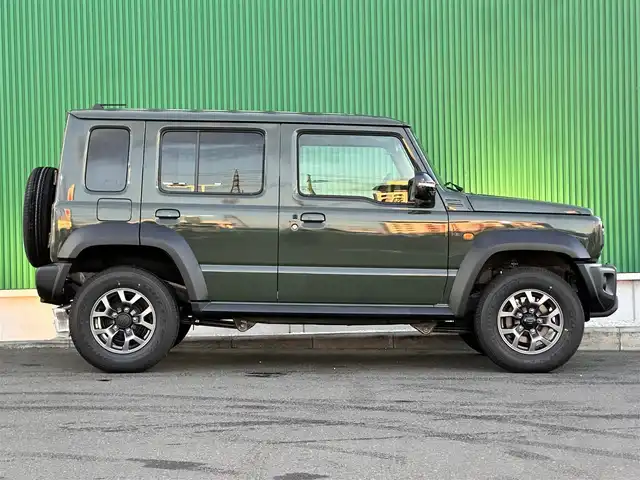 スズキ ジムニー ノマド FC 東京都 2025(令7)年 0.1千km ジャングルグリーン ワンオーナー/パートタイム4WD/衝突被害軽減ブレーキ/純正LEDオートライト/純正フォグ/純正セキュリティアラーム/アダプティブクルーズコントロール/レーンディパーチャーアラート/クリアランスソナー/ダウンヒルアシストコントロール/ウインカードアミラー/本革巻ハンドル/前席シートヒーター/オートエアコン/スマートキー/プッシュエンジンスタート/スペアキー/新車時保証書/取扱い説明書
