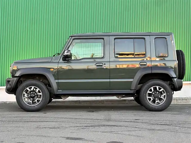 スズキ ジムニー ノマド FC 東京都 2025(令7)年 0.1千km ジャングルグリーン ワンオーナー/パートタイム4WD/衝突被害軽減ブレーキ/純正LEDオートライト/純正フォグ/純正セキュリティアラーム/アダプティブクルーズコントロール/レーンディパーチャーアラート/クリアランスソナー/ダウンヒルアシストコントロール/ウインカードアミラー/本革巻ハンドル/前席シートヒーター/オートエアコン/スマートキー/プッシュエンジンスタート/スペアキー/新車時保証書/取扱い説明書