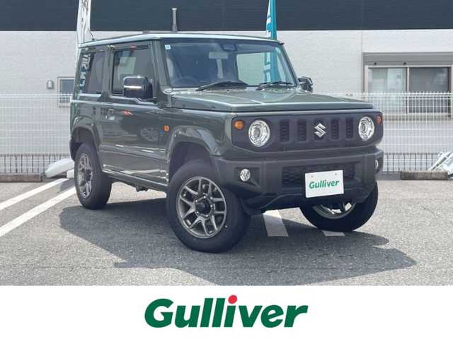 スズキ ジムニー XC 三重県 2024(令6)年 0.2万km ジャングルグリーン 登録時1315km/ワンオーナー/4WD/禁煙車/社外ディスプレイオーディオ/（AM/FM/Bluetooth/AppleCarPlay）/バックカメラ/シートヒーター/クルーズコントロール/ドラレコ/背面タイヤ/衝突軽減システム/レーンキープアシスト/コーナーセンサー/アイドリングストップ/プッシュスタート/純正アルミ/スペアキー