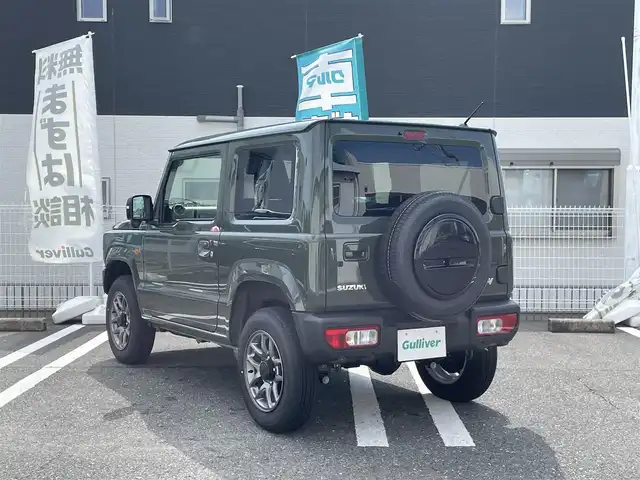 スズキ ジムニー XC 三重県 2024(令6)年 0.2万km ジャングルグリーン 登録時1315km/ワンオーナー/4WD/禁煙車/社外ディスプレイオーディオ/（AM/FM/Bluetooth/AppleCarPlay）/バックカメラ/シートヒーター/クルーズコントロール/ドラレコ/背面タイヤ/衝突軽減システム/レーンキープアシスト/コーナーセンサー/アイドリングストップ/プッシュスタート/純正アルミ/スペアキー