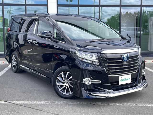 トヨタ アルファードハイブリット SR Cパッケージ 道東・釧路十勝 2016(平28)年 7.5万km スパークリングブラックパールクリスタルシャイン ・4WD/・モデリスタエアロ/・純正9インチディスプレイオーディオ/（ナビ・BT・CD・DVD・AUX・SD・USB・フルセグ）/・JBLプレミアムサウンド/・バックカメラ/・両側パワースライドドア/・パワーバックドア/・レーダークルーズコントロール/・衝突被害軽減ブレーキ/・クリアランスソナー/・横滑り防止装置/・パーキングアシスト/・前席シートヒーター/・前席パワーシート/・ステアリングスイッチ/・電動格納ミラー/・ETC/・レザーシート/・ステアリングヒーター/・LEDヘッドライト/・オートライト/・オートマチックハイビーム/・スマートキー/・プッシュスタート