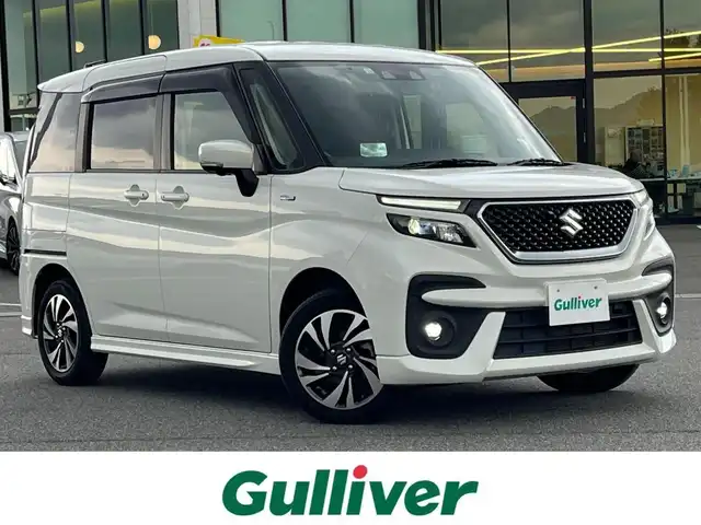 スズキ ソリオ バンディット HV MV 奈良県 2022(令4)年 2.5万km ピュアホワイトP 社外ナビ（AVIC-RL812）/（フルセグ／ＢＴ／ＣＤ／ＤＶＤ）/レーダークルーズコントロール/アラウンドビューモニター/後方コーナーセンサー/衝突軽減システム/レーンキープアシスト/両側パワースライドドア/前席シートヒーター/ヘッドアップディスプレイ/後席サンシェード/前後ドライブレコーダー（ZDR016）/ETC/純正15インチAW/スペアキーX1