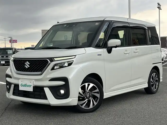スズキ ソリオ バンディット HV MV 奈良県 2022(令4)年 2.5万km ピュアホワイトP 社外ナビ（AVIC-RL812）/（フルセグ／ＢＴ／ＣＤ／ＤＶＤ）/レーダークルーズコントロール/アラウンドビューモニター/後方コーナーセンサー/衝突軽減システム/レーンキープアシスト/両側パワースライドドア/前席シートヒーター/ヘッドアップディスプレイ/後席サンシェード/前後ドライブレコーダー（ZDR016）/ETC/純正15インチAW/スペアキーX1