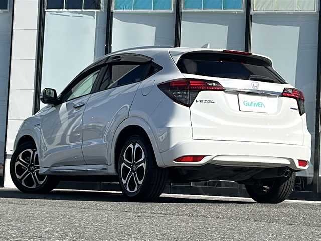 ホンダ ヴェゼル ハイブリッド Z ホンダセンシング 山形県 2018(平30)年 8.2万km プラチナホワイトパール 禁煙車/ホンダセンシング/クルーズコントロール/レーンキープアシスト/横滑り防止装置/前後ドライブレコーダー/純正ナビ/（Bluetooth/AM/FM/USB)/ステアリングスイッチ/パドルシフト/ハーフレザー/前席シートヒーター/純正フロアマット/純正ETC/スマートキー×２/オートLEDヘッドライト/電動格納ミラー/ドアバイザー