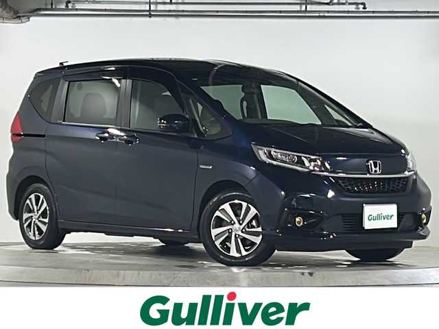 ホンダ フリード ハイブリット G ホンダセンシング 広島県 2020(令2)年 6.2万km ミッドナイトブルービームM 禁煙車/ワンオーナー/ホンダセンシング/・衝突軽減ブレーキ〈CMBS〉/・誤発進抑制機能/・ACC〈アダプティブ・クルーズ・コントロール〉/・LKAS〈車線維持支援システム〉/・行者事故低減ステアリング/・路外逸脱抑制機能/・先行車発進お知らせ機能/・標識認識機能/Cパッケージ/Sパッケージ/・本革巻ステアリングホイール/・コンビシート&専用インテリア/・15インチアルミホイール/・シートバックアッパーポケット/コンフォートビューパッケージ/純正９型ナビ(VXM-207VFNi)/・フルセグTV/CD/DVD/Bluetooth/SD/バックカメラ/両側パワースライドドア/ステアリングスイッチ/オートライト/LEDヘッドライト＋アクティブコーナリングライト/ハーフレザー/シートヒーター/スマートキー/プッシュスタート/純正ドライブレコーダー（DRH-204VD）/ETC/純正ドアバイザー/W+サイド+カーテンエアバック