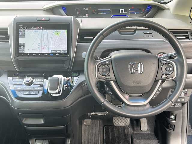 ホンダ フリード ハイブリット G ホンダセンシング 広島県 2020(令2)年 6.2万km ミッドナイトブルービームM 禁煙車/ワンオーナー/ホンダセンシング/・衝突軽減ブレーキ〈CMBS〉/・誤発進抑制機能/・ACC〈アダプティブ・クルーズ・コントロール〉/・LKAS〈車線維持支援システム〉/・行者事故低減ステアリング/・路外逸脱抑制機能/・先行車発進お知らせ機能/・標識認識機能/Cパッケージ/Sパッケージ/・本革巻ステアリングホイール/・コンビシート&専用インテリア/・15インチアルミホイール/・シートバックアッパーポケット/コンフォートビューパッケージ/純正９型ナビ(VXM-207VFNi)/・フルセグTV/CD/DVD/Bluetooth/SD/バックカメラ/両側パワースライドドア/ステアリングスイッチ/オートライト/LEDヘッドライト＋アクティブコーナリングライト/ハーフレザー/シートヒーター/スマートキー/プッシュスタート/純正ドライブレコーダー（DRH-204VD）/ETC/純正ドアバイザー/W+サイド+カーテンエアバック