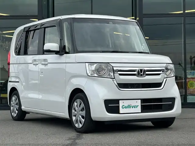 ホンダ Ｎ ＢＯＸ L 愛媛県 2023(令5)年 1.1万km プラチナホワイトパール Strada7型ナビ(BT/フルセグTV)/バックカメラ/片側電動スライドドア/ホンダセンシング/アダプティブクルーズコントロール/バックソナー/前後ドライブレコーダー/前席シートヒーター/LEDヘッドライト/オートライト/オートマチックハイビーム/アイドリングストップ/電動パーキングブレーキ/ステアリングリモコン/電格ミラー/後席サンシェイド/シガーソケット/純正ホイールキャップ/現状サマー(鉄)(155/65/R14)/DUNLOP ENASAVE EC300