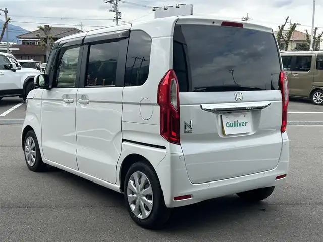 ホンダ Ｎ ＢＯＸ L 愛媛県 2023(令5)年 1.1万km プラチナホワイトパール Strada7型ナビ(BT/フルセグTV)/バックカメラ/片側電動スライドドア/ホンダセンシング/アダプティブクルーズコントロール/バックソナー/前後ドライブレコーダー/前席シートヒーター/LEDヘッドライト/オートライト/オートマチックハイビーム/アイドリングストップ/電動パーキングブレーキ/ステアリングリモコン/電格ミラー/後席サンシェイド/シガーソケット/純正ホイールキャップ/現状サマー(鉄)(155/65/R14)/DUNLOP ENASAVE EC300