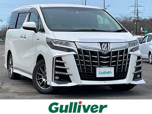 トヨタ アルファードハイブリット SR Cパッケージ 道央・札幌 2018(平30)年 10.4万km ホワイトパールクリスタルシャイン ４WD/TRDエアロ/JBLプレミアムサウンドシステム/純正ディーラーOPナビ/CD/DVD/BT/フルセグ/純正フリップダウンモニター/トヨタセーフティセンス/プリクラッシュセーフティ/横滑り防止装置/レーダークルーズコントロール/レーンキープアシスト/クリアランスソナー/ブラインドスポットモニター/パーキングサポートブレーキ/リアクロストラフィックアラート/ロードサインアシスト/アラウンドビューモニター/ビルトインETC2.0/ドライブレコーダー/デジタルインナーミラー/両側パワースライドドア/パワーバックドア/前席/２列目パワーシート/前席/２列目シートヒーター/前席エアシート/D席メモリーシート/N席/２列目オットマン/ステアリングリモコン/ハンドルヒーター/AC100V/電動パーキング/ブレーキホールド/プッシュスタート/スマートキー/LEDヘッドライト/オートライト/オートハイビーム/フォグランプ/電動格納ミラー/ウィンカーミラー/純正フロアマット/ドアバイザー/スペアキー/h粗衣社外AW付夏タイヤ積込/245/40/R20/2022年/山1mm
