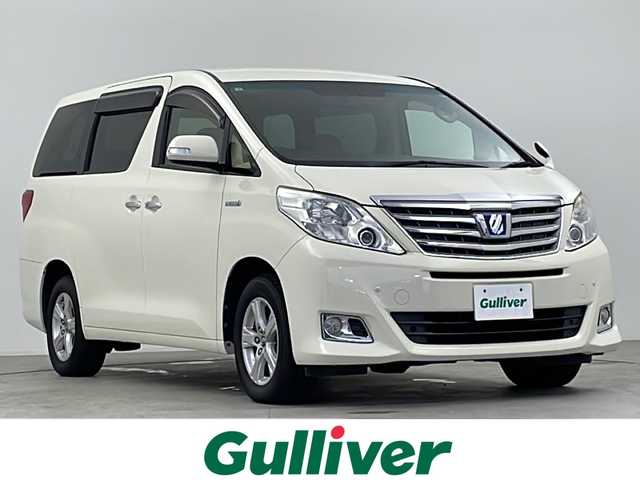 トヨタ アルファードハイブリット G 千葉県 2013(平25)年 6.1万km ゴールドパールクリスタルシャイン 禁煙車　/純正8型ナビ　/ＣＤ　ＤＶＤ　ＢＴ　フルセグ　/後席モニター　/両側パワースライドドア　/パワーバックドア　/コーナーセンサー　/クルーズコントロール　/バックカメラ　/メモリ機能付きパワーシート/ETC/HIDヘッドライト/純正アルミホイール/フロアマット/革巻きステアリング/電格ミラー/プッシュスタート