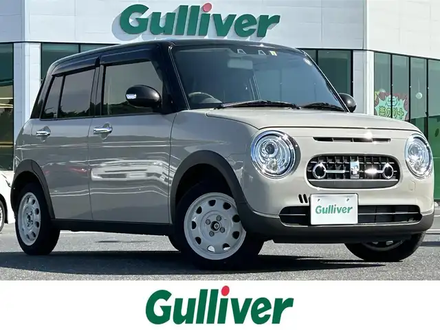 スズキ ラパン ＬＣ X 島根県 2023(令5)年 1.4万km フォーンベージュメタリック/アーバンブラウン 2トーン ワンオーナー/純正ディスプレイオーディオ/(AM/FM/USB/Bluetooth)/バックカメラ/ビルトインETC/リアパーキングセンサー/車線逸脱警報/デュアルカメラカメラブレーキサポート/横滑り防止装置/革巻きステアリング/ステアリングスイッチ/プッシュスタート/スマートキー/純正フロアマット/ドアバイザー/純正14インチアルミホイール/取扱説明書/保証書