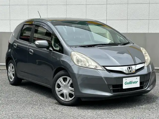 ホンダ フィット XH 東京都 2013(平25)年 6.6万km ポリッシュドメタルメタリック 純正9インチメモリナビ/CD/DVD/FM・AM/SD//フルセグTV/バックカメラ/ETC/ドライブレコーダー前後/クルーズコントロール/シートヒーター/キセノンヘッドライト/純正フロアマット/ドアバイザー/トノカバー/スマートキー/保証書/取扱説明書/スペアキー