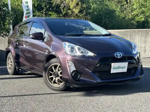 トヨタ アクア G 長崎県 2014(平26)年 8.4万km ディープアメジストマイカメタリック トヨタ純正SDナビ(FM/AM/CD/DVD/BT/TV)/ETC/ドライブモードセレクト/ステアリングリモコン/社外シフトレバー/バックカメラ/純正フロアマット/LMSport15インチアルミホイール/オートライト/手動光軸調整ダイヤル/車両接近通報/クルーズコントロール/ABS/VSC/イモビライザーシステム/スマートキー/SRSダブルエアバッグ/ISOFIX/取扱説明書/記録簿/保証書
