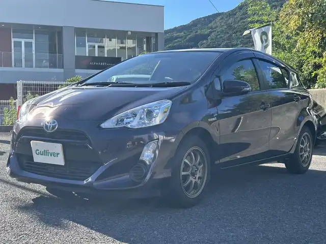 トヨタ アクア G 長崎県 2014(平26)年 8.4万km ディープアメジストマイカメタリック トヨタ純正SDナビ(FM/AM/CD/DVD/BT/TV)/ETC/ドライブモードセレクト/ステアリングリモコン/社外シフトレバー/バックカメラ/純正フロアマット/LMSport15インチアルミホイール/オートライト/手動光軸調整ダイヤル/車両接近通報/クルーズコントロール/ABS/VSC/イモビライザーシステム/スマートキー/SRSダブルエアバッグ/ISOFIX/取扱説明書/記録簿/保証書