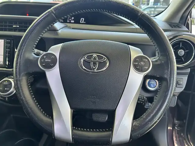 トヨタ アクア G 長崎県 2014(平26)年 8.4万km ディープアメジストマイカメタリック トヨタ純正SDナビ(FM/AM/CD/DVD/BT/TV)/ETC/ドライブモードセレクト/ステアリングリモコン/社外シフトレバー/バックカメラ/純正フロアマット/LMSport15インチアルミホイール/オートライト/手動光軸調整ダイヤル/車両接近通報/クルーズコントロール/ABS/VSC/イモビライザーシステム/スマートキー/SRSダブルエアバッグ/ISOFIX/取扱説明書/記録簿/保証書