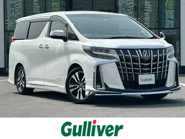 トヨタ アルファード S Cパッケージ 岡山県 2018(平30)年 5.8万km ホワイトパールクリスタルシャイン 登録時走行距離58026km/ワンオーナー/モデリスタエアロ/純正10インチナビ/フルセグTV(AM.FM.CD.DVD.TV.BT)/フリップダウンモニター/両側パワースライドドア/前後バックカメラ/ETC2.0/ドライブレコーダー/シートヒーター/エアシート/ステアリングヒーター/クリアランスソナー/衝突軽減ブレーキ/横滑り防止装置/レーダークルーズコントロール/レーンキープアシスト/オートライト/オートマチックハイビーム/電動リアゲート/18インチ純正AW/純正フロアマット/レザーシート/全席パワーシート