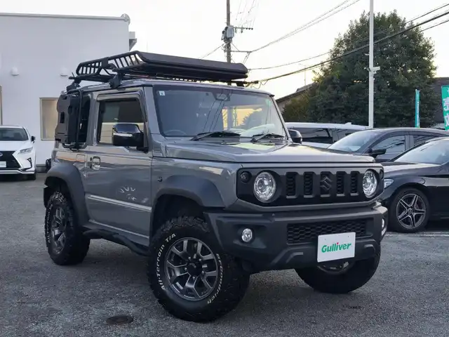 スズキ ジムニー シエラ JC 熊本県 2021(令3)年 1.5万km ミディアムグレー ワンオーナー/1インチリフトアップ車/ルーフキャリア/サイドステップバー/リアラダー/サイドラック（ロトパックス）/社外8インチナビ（CN-RZ865）/【フルセグTV/Bluetooth再生/CD/DVD】/車線逸脱警報システム/デュアルセンサーブレーキサポート/シートヒーター/LEDオートライト/フォグライト/ビルトインETC/純正15インチAW/純正フロアマット/ドアバイザー/保証書/取扱説明書