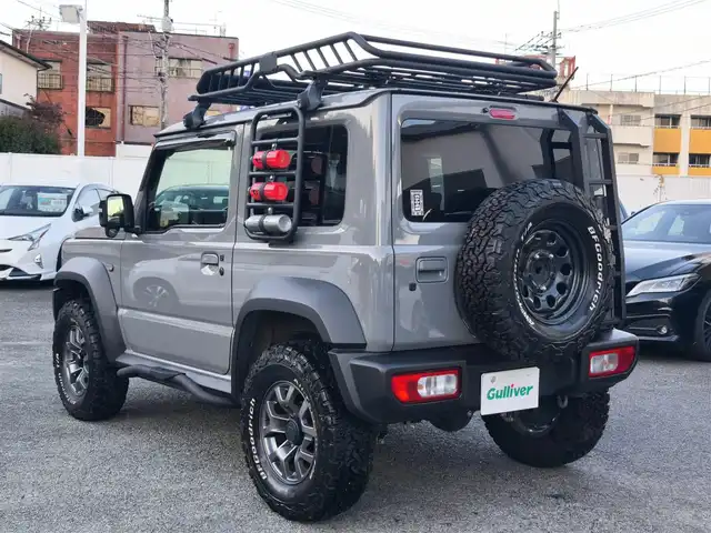 スズキ ジムニー シエラ JC 熊本県 2021(令3)年 1.5万km ミディアムグレー ワンオーナー/1インチリフトアップ車/ルーフキャリア/サイドステップバー/リアラダー/サイドラック（ロトパックス）/社外8インチナビ（CN-RZ865）/【フルセグTV/Bluetooth再生/CD/DVD】/車線逸脱警報システム/デュアルセンサーブレーキサポート/シートヒーター/LEDオートライト/フォグライト/ビルトインETC/純正15インチAW/純正フロアマット/ドアバイザー/保証書/取扱説明書