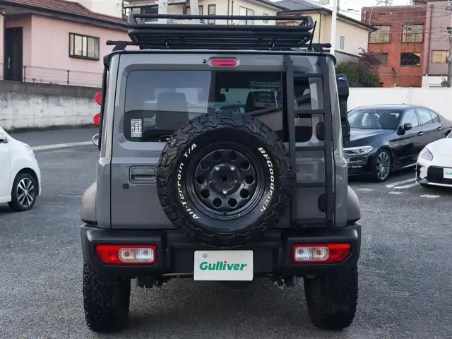 スズキ ジムニー シエラ JC 熊本県 2021(令3)年 1.5万km ミディアムグレー ワンオーナー/1インチリフトアップ車/ルーフキャリア/サイドステップバー/リアラダー/サイドラック（ロトパックス）/社外8インチナビ（CN-RZ865）/【フルセグTV/Bluetooth再生/CD/DVD】/車線逸脱警報システム/デュアルセンサーブレーキサポート/シートヒーター/LEDオートライト/フォグライト/ビルトインETC/純正15インチAW/純正フロアマット/ドアバイザー/保証書/取扱説明書