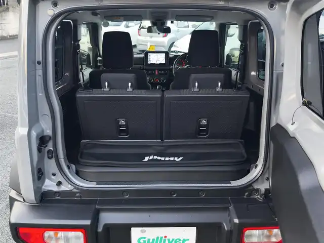 スズキ ジムニー シエラ JC 熊本県 2021(令3)年 1.5万km ミディアムグレー ワンオーナー/1インチリフトアップ車/ルーフキャリア/サイドステップバー/リアラダー/サイドラック（ロトパックス）/社外8インチナビ（CN-RZ865）/【フルセグTV/Bluetooth再生/CD/DVD】/車線逸脱警報システム/デュアルセンサーブレーキサポート/シートヒーター/LEDオートライト/フォグライト/ビルトインETC/純正15インチAW/純正フロアマット/ドアバイザー/保証書/取扱説明書