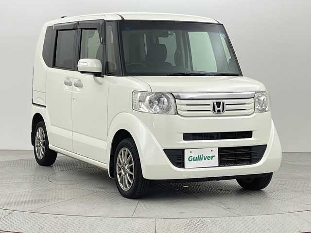 ホンダ Ｎ ＢＯＸ G ターボパッケージ 新潟県 2013(平25)年 9.3万km プレミアムホワイトパール 4WD/社外メモリナビ/フルセグ/　CD/DVD/SD/バックカメラ/両側パワースライドドア/スマートキー×２/キセノンヘッドライト/クルーズコントロール/プッシュスタート/ドライブレコーダー/ETC/SW付きスタッドレス積み込み/　（６mm）