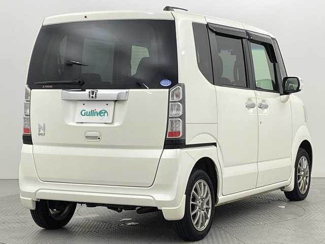 ホンダ Ｎ ＢＯＸ G ターボパッケージ 新潟県 2013(平25)年 9.3万km プレミアムホワイトパール 4WD/社外メモリナビ/フルセグ/　CD/DVD/SD/バックカメラ/両側パワースライドドア/スマートキー×２/キセノンヘッドライト/クルーズコントロール/プッシュスタート/ドライブレコーダー/ETC/SW付きスタッドレス積み込み/　（６mm）