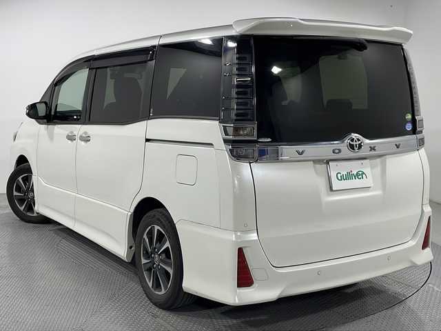 トヨタ ヴォクシー ZS 煌Ⅱ 広島県 2020(令2)年 5.7万km ホワイトパールクリスタルシャイン 禁煙車/ＡＬＰＩＮＥ9型ナビ/ＡＬＰＩＮＥ12.8型フリップダウンモニター/バックカメラ/両側パワースライドドア/クルーズコントロール/前後ドラレコ/ＥＴＣ/オートマチックハイビーム/衝突軽減/レーンキープアシスト/コーナーセンサー/LEDヘッドライト/エアバッグ(運転席/助手席/サイド/カーテン)/純正16インチアルミホイール(205/60/R16)