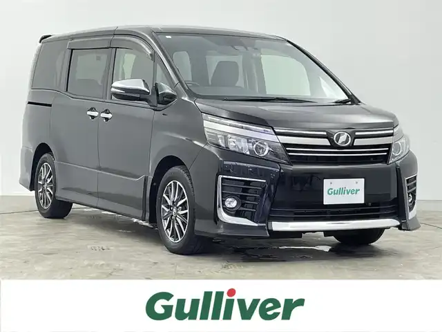 トヨタ ヴォクシー ZS 煌Ⅱ 千葉県 2017(平29)年 6.8万km ブラック 禁煙車/トヨタセーフティセンス/　・プリクラッシュセーフティ/　・レーンディパーチャーアラート/　・オートマチックハイビーム/　・先行車発進お知らせ機能/純正9インチメモリナビ/　CD/DVD/BT/フルセグTV/両側パワースライドドア/ビルトインETC/バックカメラ/電動格納ミラー/革巻きステアリング/ステアリングスイッチ/プッシュスタート&スマートキー/純正16インチアルミホイール/LEDヘッドライト