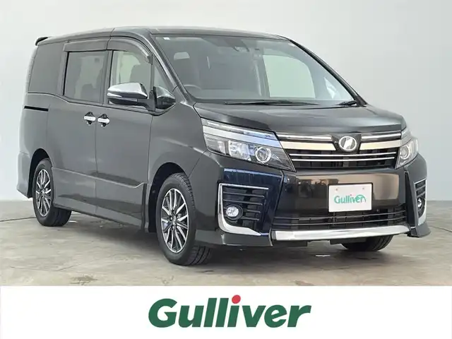 トヨタ ヴォクシー ZS 煌Ⅱ 千葉県 2017(平29)年 6.8万km ブラック 禁煙車/トヨタセーフティセンス/　・プリクラッシュセーフティ/　・レーンディパーチャーアラート/　・オートマチックハイビーム/　・先行車発進お知らせ機能/純正9インチメモリナビ/　CD/DVD/BT/フルセグTV/両側パワースライドドア/ビルトインETC/バックカメラ/電動格納ミラー/革巻きステアリング/ステアリングスイッチ/プッシュスタート&スマートキー/純正16インチアルミホイール/LEDヘッドライト