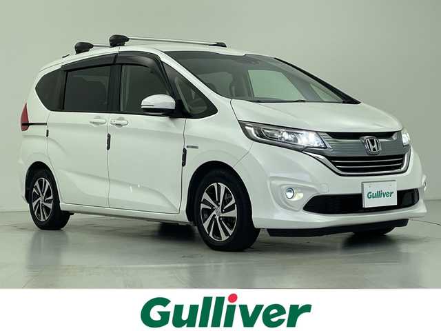 ホンダ フリード ハイブリット G ホンダセンシング 愛知県 2017(平29)年 6万km ホワイトオーキッドパール 社外ナビ/・Bluetooth/・CD/DVD/・フルセグテレビ/バックカメラ/レーダークルーズコントロール/衝突軽減ブレーキ/レーンキープアシスト/ハーフレザーシート/ルーフキャリア/RAZOシフトノブ/両側パワースライドドア/ビルトインETC