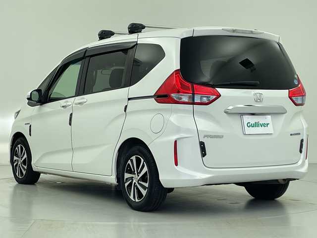 ホンダ フリード ハイブリット G ホンダセンシング 愛知県 2017(平29)年 6万km ホワイトオーキッドパール 社外ナビ/・Bluetooth/・CD/DVD/・フルセグテレビ/バックカメラ/レーダークルーズコントロール/衝突軽減ブレーキ/レーンキープアシスト/ハーフレザーシート/ルーフキャリア/RAZOシフトノブ/両側パワースライドドア/ビルトインETC