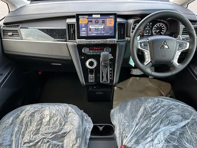 三菱 デリカＤ：５ シャモニー 岡山県 2025(令7)年 0.1千km ブラックダイヤモンド 登録済未使用車/登録時走行距離7km/ワンオーナー/禁煙車/ディーゼルターボ/ALPINE11インチナビ/　(CD/DVD/フルセグTV/Bluetooth)/バックカメラ/クルーズコントロール(追従走行あり)/衝突被害軽減システム/車線逸脱警報（レーンキープアシスト）/両側パワースライドドア/ハーフレザーシート/シートヒーター/パワーバックドア/ステアリングヒーター/革巻きステアリング/ステアリングスイッチ/純正LEDヘッドライト/フォグライト/オートライト/プッシュスタート/スマートキー/スペアキー×1/パドルシフト/アイドリングストップ/純正アルミホイール 18インチ/電動格納ミラー/横滑防止装置/盗難防止装置/取扱説明書/新車時整備手帳（保証書）