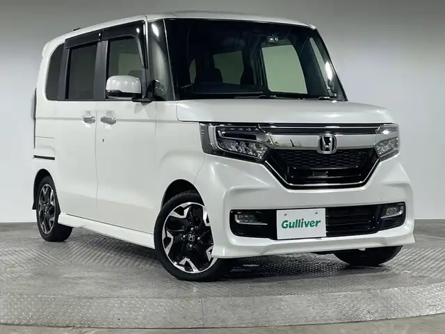 ホンダ Ｎ ＢＯＸ カスタム G L ターボ ホンダセンシング 神奈川県 2020(令2)年 2.9万km プラチナホワイトパール ホンダセンシング/純正8型ナビ/・BT/フルセグTV/CD/DVD/SD/AppleCarPlay/バックカメラ/ハーフレザーシート/シートヒーター(D/N)/ビルトインETC/両側電動スライドドア/前後ドライブレコーダー/革巻きステアリング/ステアリングスイッチ/パドルシフト/Autoライト/LEDヘッドライト/フォグランプ/2.5AUSBポート(2口)/シートリフター/電動格納ミラー/ウィンカーミラー/純正フロアマット/純正15インチアルミホイール/純正ドアバイザー