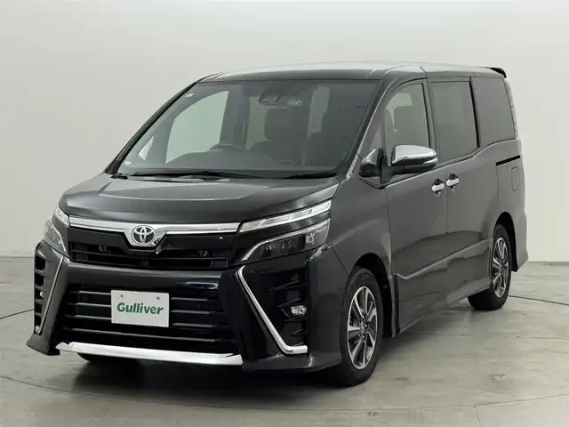 トヨタ ヴォクシー ZS 煌Ⅲ 福岡県 2021(令3)年 3.9万km ブラック 後席モニター　/純正１０型ナビ／フルセグＴＶ　/バックカメラ　/ビルトインETC　/前後ドラレコ　/クルーズコントロール　/コーナーセンサー　/衝突軽減ブレーキ　/レーンキープ　/アクセル踏み間違い防止　/両側電動スライドドア　/ハーフレザーシート