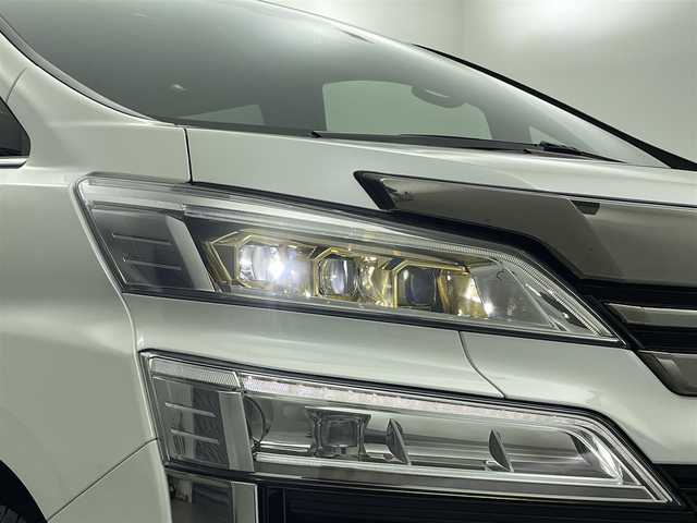 トヨタ ヴェルファイア ゴールデンアイズⅡ 愛媛県 2021(令3)年 4.2万km ホワイトパールクリスタルシャイン サンルーフ/純正フリップダウンモニター/純正ナビ/・Bluetooth/・HDMI入力端子/・USB入力端子/フルセグTV/バックカメラ/ビルトインETC/ドライブレコーダー/両側パワースライドドア/コーナーセンサー/電動リアゲート/衝突軽減システム/クルーズコントロール（追従有）/レーンキープアシスト/オートライト/オートマチックハイビーム/RSA/nanoeエアコン/LEDヘッドライド/プッシュスタート/スマートキー/スペアキー/取扱説明書/保証書