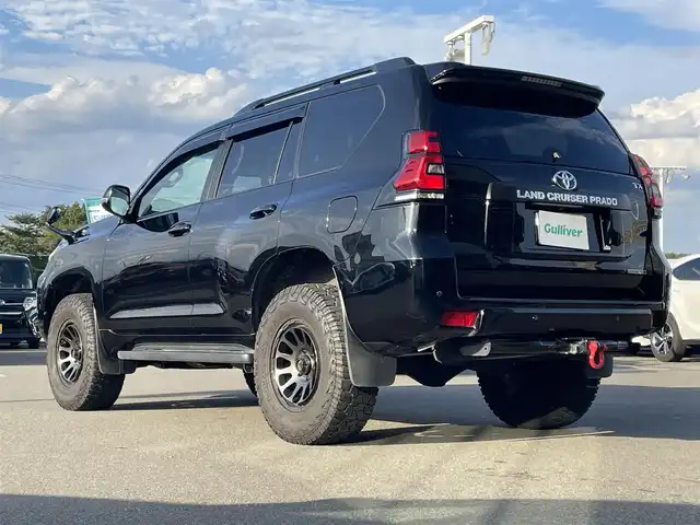 トヨタ ランドクルーザー プラド TX Lパッケージ 東京都 2021(令3)年 3.9万km ブラック 7人乗り/サンルーフ/CURTヒッチメンバー/JAOS BATTLEZ リフトアップ/トヨタセーフティセンス/・プリクラッシュセーフティ/・レーンディパーチャーアラート/・先行車発進告知/・クリアランスソナー/・レーダークルーズコントロール/・オートハイビーム/アルパイン ９インチナビ 【X9NX】/・AM/FM/CD/DVD/USB/SD/・HDMI/Bluetooth/フルセグTV/ビルトインETC2.0/ナビ連動ドライブレコーダー【DVR-C320R】/バックカメラ【ステアリング連動】/ALPINE後席用モニター/ALPINEツィーター/レザーシート（黒）/シートベンチレーション/シートヒーター/パワーシート/LEDヘッドライト/デルタフォース：オーバル（AW）/YOKOHAMA：ジオランダーX-AT/保証書・取説・スペアキー