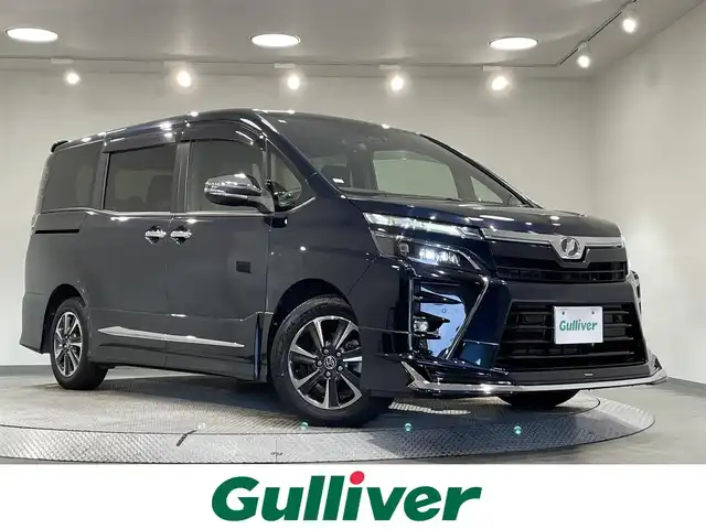 トヨタ ヴォクシー ZS 煌Ⅱ 愛知県 2019(平31)年 3.6万km ブラッキッシュアゲハガラスフレーク 純正１０インチナビ/モデリスタエアロ/両側パワースライドドア/衝突軽減ブレーキ/レーンキープアシスト/クリアランスソナー/先行車発進告知/クルーズコントロール/ドライブレコーダー/ビルトインＥＴＣ/バックカメラ/アクセサリーソケット/アイドリングストップ/LEDヘッドライト/オートハイビーム/ISOFIX/純正フロアマット/純正16インチアルミホイール
