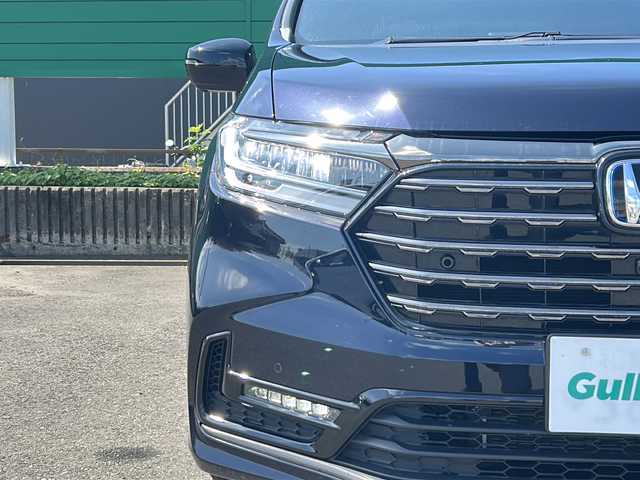 ホンダ オデッセイ ハイブリッド e:HEVアブソルート EXブラックED 茨城県 2023(令5)年 1.4万km プレミアムヴィーナスブラックP 純正15.6インチフリップダウンモニター/ホンダセンシング/-衝突軽減ブレーキ/-誤発信抑制機能/-歩行者事故軽減ステアリング/-レーンキープアシスト/-アダプティブクルーズコントロール/-車線維持システム/純正11.4インチナビ/マルチビューカメラ/バックカメラ/両側パワースライドドア/LEDヘッドライト/オートライト/レザーシート/シートヒーター/パワーシート/2列目オットマン/ワイアレス充電/USBチャージャー/ビルトインETC/スマートキー/プッシュスタート/禁煙車