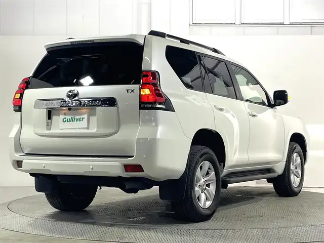 トヨタ ランドクルーザー プラド TX Lパッケージ 大阪府 2022(令4)年 2万km ホワイトパールクリスタルシャイン ベージュ革シート 純正9incナビTV バックカメラ パワーシート/ヒーター/エアコン レーダークルコン 衝突軽減ブレーキ レーンアシスト オートハイビーム ルーフレール クリアランスソナー 4WD