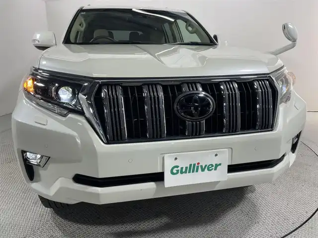 トヨタ ランドクルーザー プラド TX Lパッケージ 大阪府 2022(令4)年 2万km ホワイトパールクリスタルシャイン ベージュ革シート 純正9incナビTV バックカメラ パワーシート/ヒーター/エアコン レーダークルコン 衝突軽減ブレーキ レーンアシスト オートハイビーム ルーフレール クリアランスソナー 4WD