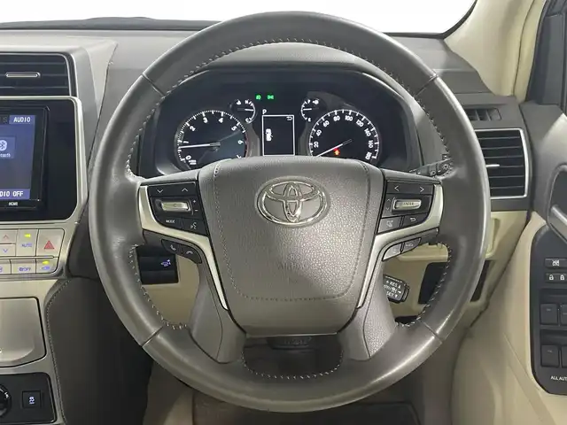 トヨタ ランドクルーザー プラド TX Lパッケージ 大阪府 2022(令4)年 2万km ホワイトパールクリスタルシャイン ベージュ革シート 純正9incナビTV バックカメラ パワーシート/ヒーター/エアコン レーダークルコン 衝突軽減ブレーキ レーンアシスト オートハイビーム ルーフレール クリアランスソナー 4WD