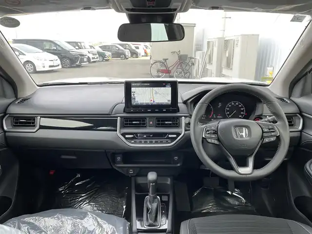 ホンダ ＷＲ－Ｖ Z+ 佐賀県 2024(令6)年 0.1万km未満 プラチナホワイトパール Honda SENSING/衝突軽減ブレーキ/アダプティブクルーズコントロール/車線維持支援システム/純正8型ナビゲーション[LXM-245ZFEi]/AM　FM　BT　USB　フルセグTV/バックカメラ/スマートキー×２/パドルシフト/革巻きステアリング/ステアリングリモコン/純正17インチアルミホイール/LEDヘッドライト/フォグライト