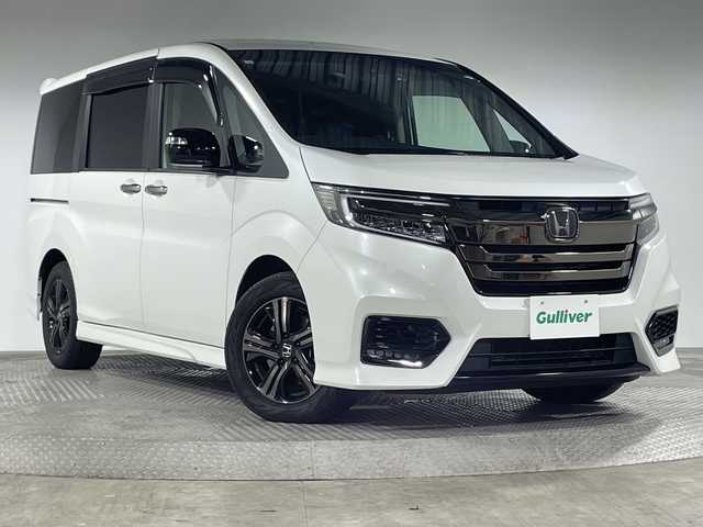 ホンダ ステップワゴン スパーダ eHEV G EXホンダS 神奈川県 2020(令2)年 6.8万km プラチナホワイトパール 純正10型メモリナビゲーション【VXM-207Wi】/フルセグ　CD　Bluetooth　HDMI　USB　SD　Applecarplay　/純正後席フリップダウンモニター/バックカメラ/両側電動スライドドア/ブラックスタイル/ホンダセンシング/アダブティブクルーズコントロール/CMBS衝突軽減ブレーキ/誤発進抑制機能/LKAS車線維持支援システム/標識認識機能/先行車発進お知らせ機能/歩行者事故低減ステアリング/路外逸脱抑制機能/アイドリングストップ/革巻きステアリング/合皮コンビレザーシート/前席シートヒーター/純正前方ドライブレコーダー/純正ビルトインETC/シートリフター/ECON/プッシュスタート/スマートキー/LEDヘッドライト/LEDフロントフォグランプ/オートライト/純正16インチアルミホイール/純正サイド/リアスポイラー/電動パーキングブレーキ/ブレーキオートホールド/電格ウインカーミラー/スペアキー