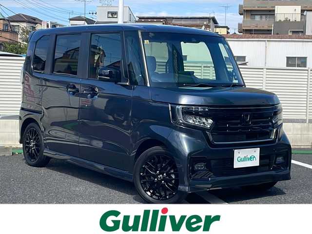 ホンダ Ｎ ＢＯＸ カスタム L ターボ 東京都 2023(令5)年 0.6万km メテオロイドグレーメタリック Gathersナビ　型式：LXU-237NBi/【Bluetooth/TV/DVD/CD/SD】/バックカメラ/ETC/衝突軽減ブレーキ/レーンキープアシスト/クリアランスソナー/レーダークルーズコントロール/電動パーキングブレーキ/両側パワースライドドア/D/N席シートヒーター/プッシュスタート/スマートキー×2/パドルシフト/LEDオートライト