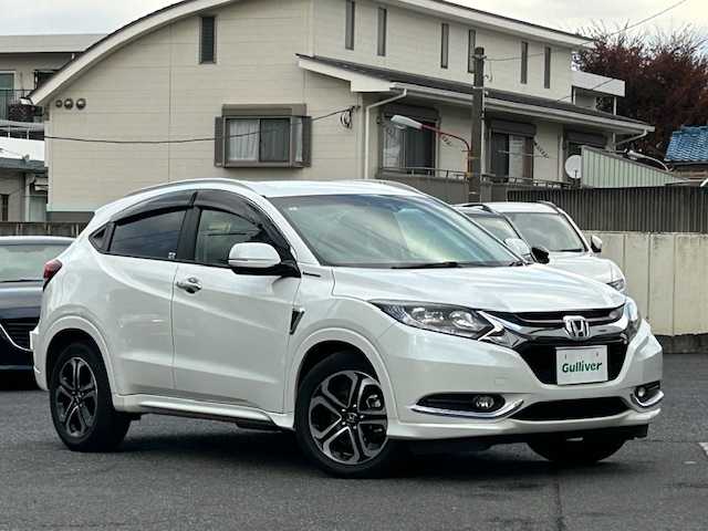 ホンダ ヴェゼル ハイブリッド Z 東京都 2015(平27)年 3.2万km ホワイトオーキッドパール ワンオーナー/純正メモリナビ/AM/FM/CD/DVD/BT/フルセグ/ 『VXM-155VFi』/バックカメラ/シティブレーキアクティブシステム/クルーズコントロール/パドルシフト/DN席シートヒーター/LEDヘッドライト/ドライブレコーダー/ETC/トノカバー/純正フロアマット/スペアキー×1/保証書/取扱説明書