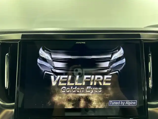 トヨタ ヴェルファイア Z Aエディション ゴールデンアイズ 佐賀県 2016(平28)年 5.2万km ホワイトパールクリスタルシャイン ツインムーンルーフ/ALPINE11インチBIGXナビ/ALPINEフリップダウンモニター/バックカメラ/両側パワースライドドア/クルーズコントロール/コーナーセンサー/ハーフレザーシート/オットマン/電動パーキングブレーキ/オートブレーキホールド/ウッドコンビステアリング/ステアリングスイッチ/プッシュスタート/スマートキー/LEDヘッドライト/フォグライト/純正アルミホイール
