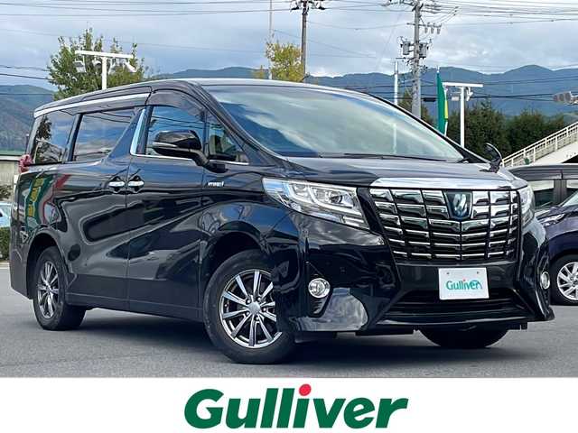 トヨタ アルファードハイブリット X 長野県 2016(平28)年 8.4万km ブラック フルタイム4WD/純正9インチナビ（NSZT-Y66T）/FM・AM・DVD・CD・フルセグテレビ/Bluetooth Audio/純正12.1インチフリップダウンモニター/衝突被害軽減ブレーキ/前後ドライブレコーダー/前後コーナーセンサー/ワイパーデアイサー/AC100V/LEDヘッドライト/オートライト/ドアバイザー/プッシュスタート/スマートキー/スペアキー/保証書/ETC