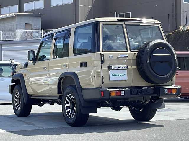 トヨタ ランドクルーザー AX 山梨県 2024(令6)年 0.1万km ベージュ ワンオーナー/純正ナビ/ワンセグTV/純正CD/DVD/Bluetooth/バックカメラ/セーフティセンス/デフロック/オートハイビーム/クルーズコントロール/ドライブレコーダー/純正16インチAW/キーレス/スペアキー/保証書/取説
