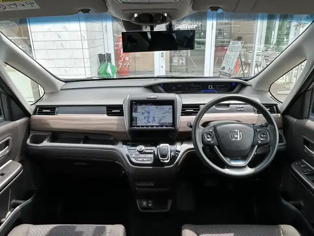ホンダ フリード ハイブリット G ホンダセンシング 兵庫県 2020(令2)年 3.1万km スーパープラチナグレーメタリック ワンオーナー /純正9インチナビ/CD/DVD/DTV/Bluetooth/USB/バックカメラ/レーダークルーズコントロール/両側パワースライドドア /シートヒーター /LEDオートライト/ステアリングスイッチ/純正ホイール付きスタッドレス積込/ビルトインETC/前後ドライブレコーダー/スマートキー/スペアキー /プッシュスタート /純正フロアマット/ドアバイザー/電動格納ミラー/フロントワイパーデアイサー