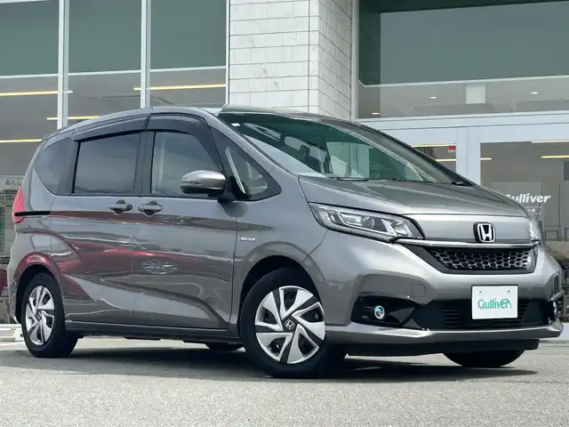 ホンダ フリード ハイブリット G ホンダセンシング 兵庫県 2020(令2)年 3.1万km スーパープラチナグレーメタリック ワンオーナー /純正9インチナビ/CD/DVD/DTV/Bluetooth/USB/バックカメラ/レーダークルーズコントロール/両側パワースライドドア /シートヒーター /LEDオートライト/ステアリングスイッチ/純正ホイール付きスタッドレス積込/ビルトインETC/前後ドライブレコーダー/スマートキー/スペアキー /プッシュスタート /純正フロアマット/ドアバイザー/電動格納ミラー/フロントワイパーデアイサー